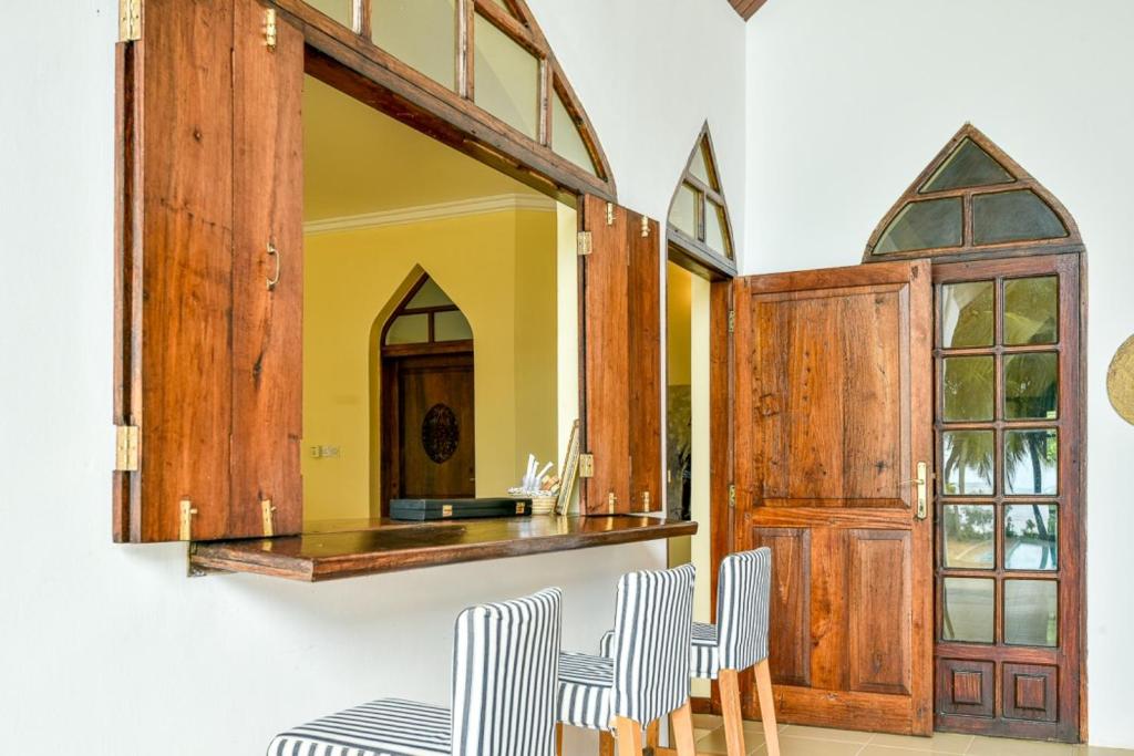 Zanzibar wooden bar hatch — a signature architectural detail