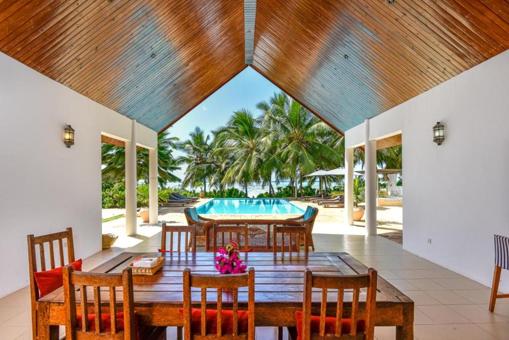 Open-air pavilion looking out to the pool and beach